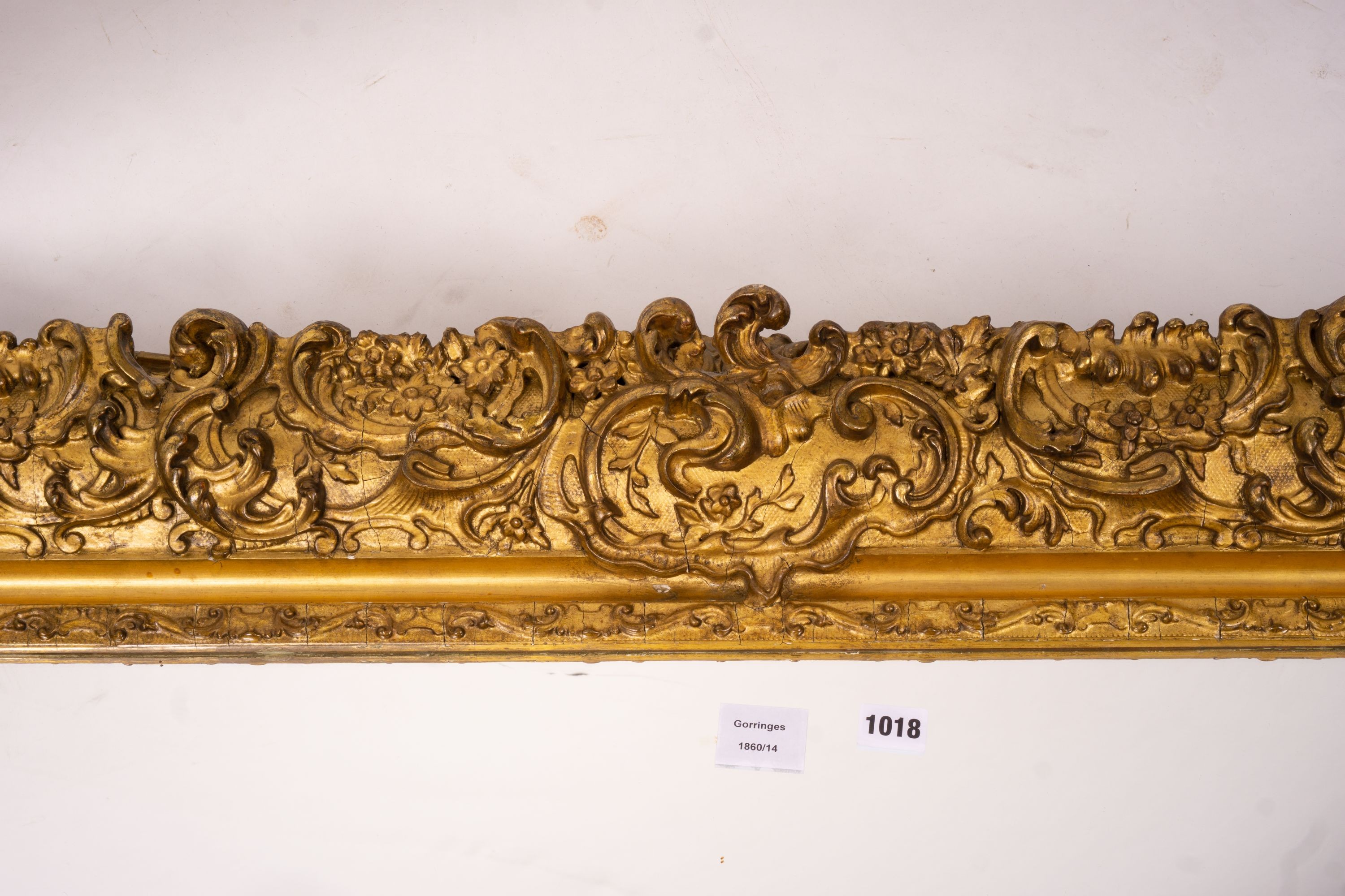 An ornate Victorian giltwood and gesso rectangular wall mirror (formerly a picture frame) width 130cm, height 112cm